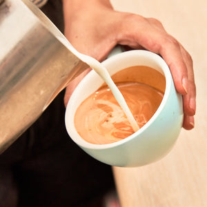 Altura Coffee Barista pouring Latte Art