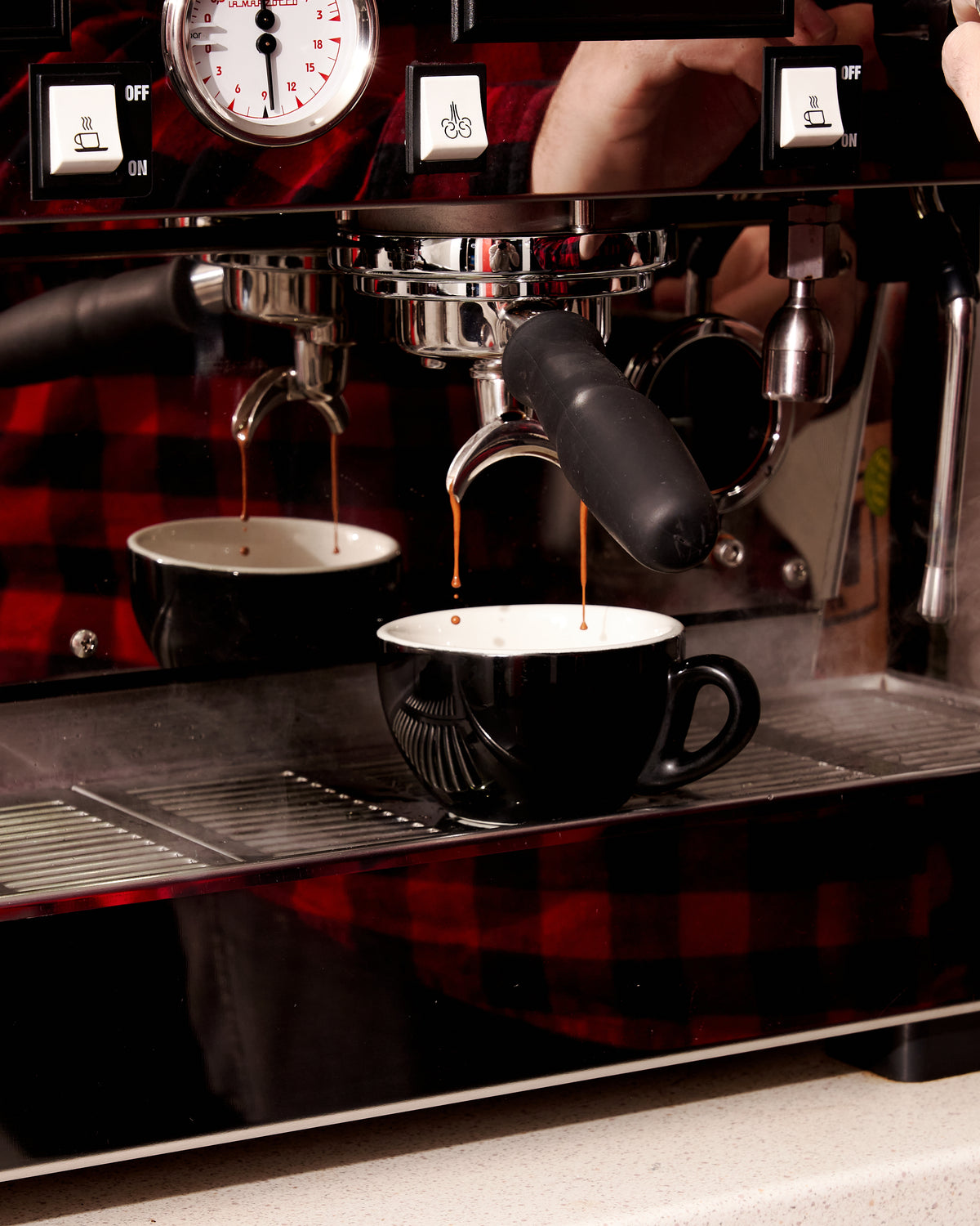 Domestic espresso machines on the bench at the Altura Coffee roastery, Findon